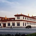Traditional Ancient Architecture With White Walls Red Borders And Golden Roof Decorations