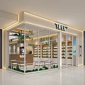 Modern Mall Shop With Glass Facade Display Shelves Tables And Green Plants