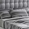 Modern Double Bed With Tufted Headboard And Striped Bedding Pillows 3d model