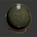 Worn Green Military Helmet With Red Strap And White Emblem Design Details