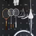 Sports Equipment Wall Display With Badminton Tennis Rackets Bicycle Skateboards And Tires