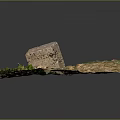 Rough Natural Stone Block on Square Dirt Ground Surrounded by Small Stones and Green Plants