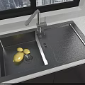 Black Kitchen Sink With Lemon And Silver Faucet By Window In Kitchen