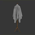 Wooden Coat Rack With Gray Knitted Shawl On Simple Dark Background