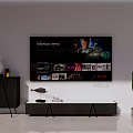Modern TV Stand With Flat Screen TV Black Side Cabinet And Green Cactus Decor