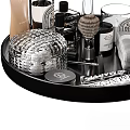 Elegant Bathroom Accessories On Black Tray With Silver Container Brush Candle Towel And Green Leaves