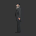 Male Character In Suit With Black Hat Beard And Green Tie Standing Against Dark Background