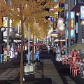 Vibrant Night Commercial Street With Street Lamps Neon Lights Outdoor Seating And Shop Signs