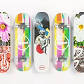 Vibrant Graphic Skateboards with Floral Prints Colorful Stripes Statue Design and Limited Logo