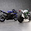 Two Sporty Green White And Blue Motorcycles On Gray Floor With Gray Walls