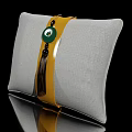 Gray Fabric Pillow With Yellow Strap Green Circular Accent And Tassel