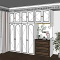 Modern White Wardrobe With Golden Handles And Brown Drawer Cabinet Decorated With Plants