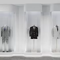 Modern Clothing Store With Transparent Display Cases And Mannequins In Stylish Suits
