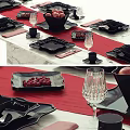 Black Dinnerware Set With Red Tablecloth Fruits And Crystal Wine Glasses