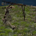 Men in Military Uniforms Preparing Rifles While Standing and Lying on Grassland Field