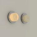 Two Minimalist Wall Sconces With Cream Lampshade And Round Base On Light Colored Wall