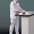 Man Wearing White Chef Uniform Kneading Dough At White Counter With Black Top