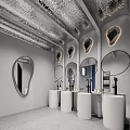 Public Restroom with Gray Walls Round Mirrors Blue Handrails and White Fixtures