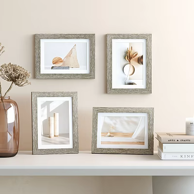 Decorative Gray Photo Frames On Wall Shelf With Dried Flowers And Books 3d model