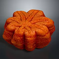Delicious Orange Flower Shaped Cake With Textured Surface And Soft Interior