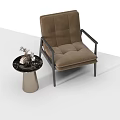 Brown Upholstered Accent Chair With Black Frame Side Table And Decorative Items 3d model