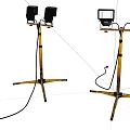 Portable Spotlights With Yellow Black Tripod Stands And Power Cords