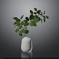 White Ceramic Vase With Lush Green Leaves In Modern Interior Decor Setup