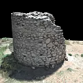 Ancient Stone Ruin Tower Surrounded by Desert Sand and Sparse Weeds Isolated on Black Background