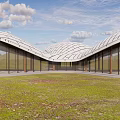 Modern Architectural Design With Curved Roof Glass Walls And Grassland Landscape