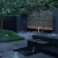 Tranquil Residential Landscape With Black Stone Steps Mist Green Shrubs Trees And White Lights