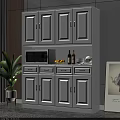 White Kitchen Sideboard With Cabinets Drawers Open Shelf Microwave Wine Bottles Lemons And Green Plant