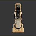 Ornate Golden Metal Decor With Black Cracked Surface Green Gem And Reflection Base