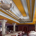 Classic Restaurant Interior With Yellow Ceiling White Molding Chandeliers Marble Columns Dark Wooden Dining Tables