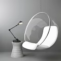 Modern Transparent Hanging Chair With White Cushion And Concrete Base Table Lamp