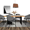 Wooden Dining Table Set With Four Gray Chairs Orange Pendant Lamp And Flowers In Vase