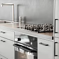 Modern Kitchen With Sleek Countertop Gas Stove Oven And Appliances