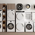 Modern Front Loading Washing Machines Stacked With Detergent Bottles And Towels