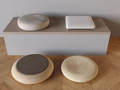 Cushions With Various Textures And Shapes Near Light Gray Cabinet On Wooden Floor 3d model