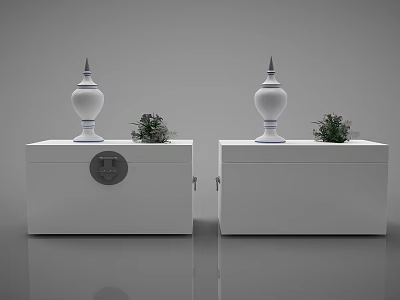 Two White Chests with Decorative Bottles and Small Potted Plants on Top 3d model