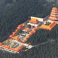 Ancient Chinese Architecture With Traditional Layout Orange Roofs And Multi Tiered Tower Surrounded By Forests