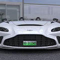 White Convertible Sports Car With Sleek Front Design And Green License Plate