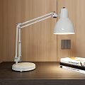 White Adjustable Desk Lamp on Dark Table with Wooden Wall and Books