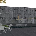 Garden Courtyard With Stone Wall Waterfall Sculpture And Outdoor Chairs