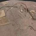 Wood Planks and Stone Slabs Scattered on Dirt Construction Site Ground