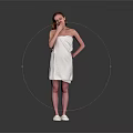 A Woman Wrapped in White Towel Standing with Hand on Cheek and White Slippers