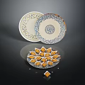 Yellow Diamond Shaped Sweet Treats In Ornate Bowl With Decorative Patterned Plates