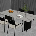 Modern White Marble Dining Table With Black Legs Four Chairs Fruit Bowl And Green Plant