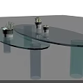 Modern Transparent Glass Coffee Table With Blue Cylindrical Bases And Small Potted Plants