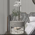Elegant Marble Bedside Table with Vase Green Plant and Decorative Item in Modern Bedroom