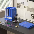 Organized Office Desk With Blue Folders File Boxes Stationery And Supplies